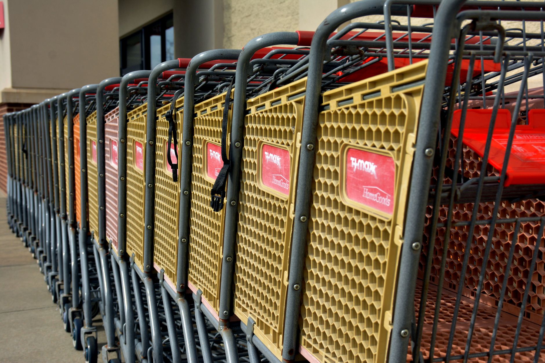 row of empty shopping carts at retail store