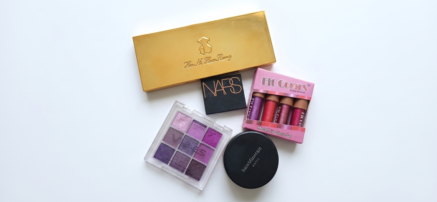 Assorted makeup essentials. Color Vibes eyeshadow, LA Colors Lip gloss, NARS LAGUNA